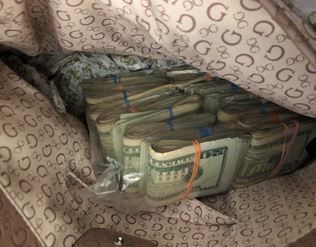 Man arrested, drugs, 3 handguns, $18K in cash seized in South Side drug raid, Madison police say